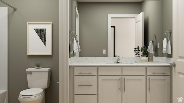 full bath featuring toilet, vanity, and a tub to relax in