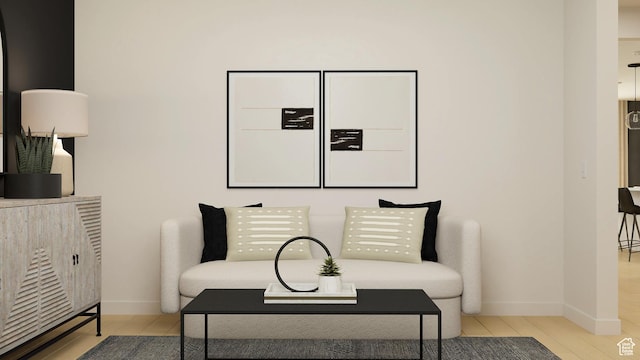 sitting room featuring wood finished floors and baseboards