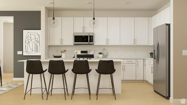 kitchen with stainless steel appliances, white cabinets, light countertops, and light wood-style flooring