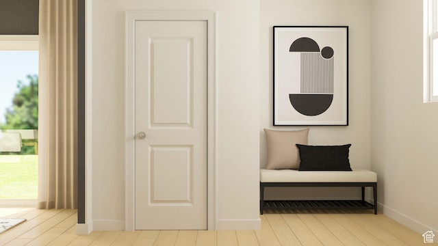 sitting room with wood finished floors and baseboards