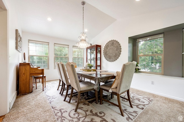 dining space with a chandelier, vaulted ceiling, baseboards, light carpet, and recessed lighting