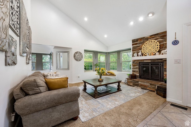 tiled living area featuring high vaulted ceiling, recessed lighting, a fireplace, and baseboards