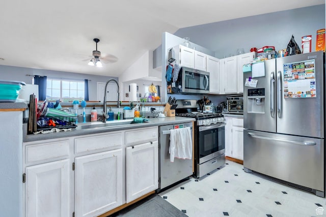 606 N 560 W, Santaquin, UT 84655 - kitchen with appliances with stainless steel finishes, light flooring, a sink, ceiling fan, and vaulted ceiling