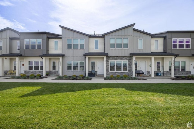 3137 S 225 W Unit 404, Nibley, UT 84321 - multi unit property with board and batten siding, stone siding, and a front yard