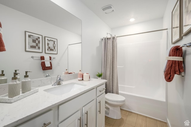 full bath featuring toilet, vanity, shower / bath combo, and wood finished floors