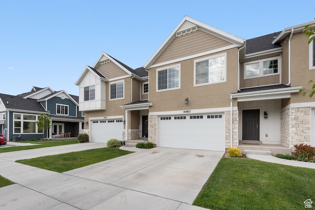 4483 S Parkbury Way, Salt Lake City, UT 84129 - multi unit property with stone siding, stucco siding, a garage, and driveway