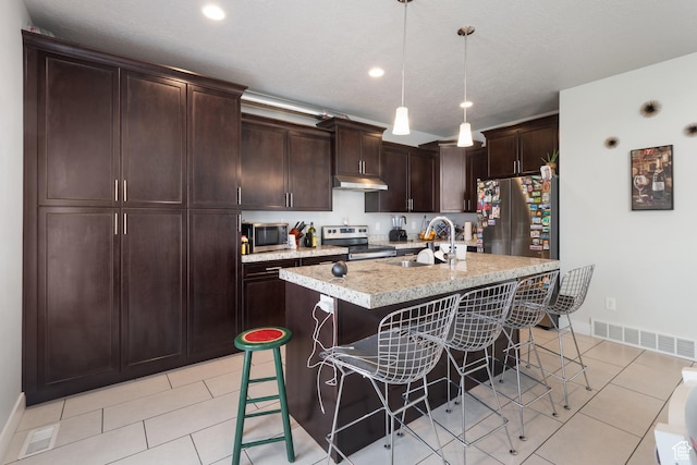 4483 S Parkbury Way, Salt Lake City, UT 84129 - kitchen with stainless steel appliances, a sink, a kitchen breakfast bar, baseboards, and recessed lighting