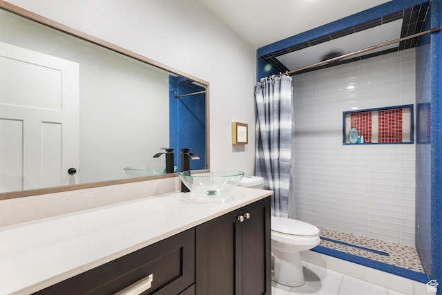 4483 S Parkbury Way, Salt Lake City, UT 84129 - bathroom featuring toilet, a tile shower, vanity, and tile patterned floors