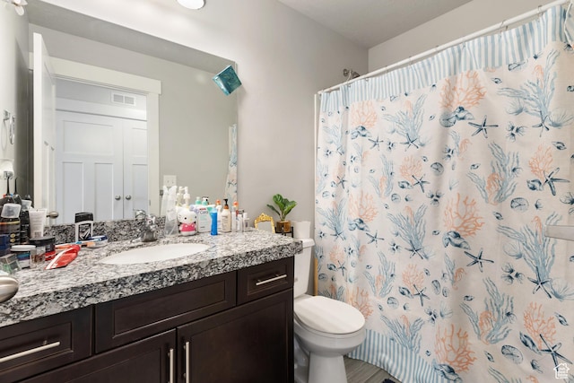 4483 S Parkbury Way, Salt Lake City, UT 84129 - bathroom with toilet, vanity, and curtained shower