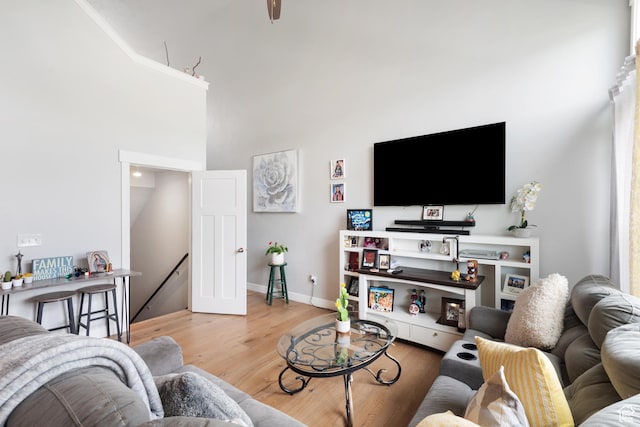 4483 S Parkbury Way, Salt Lake City, UT 84129 - living area featuring wood finished floors, a high ceiling, and baseboards