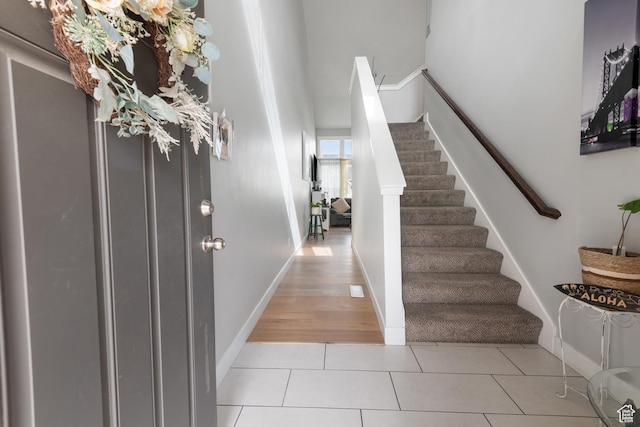 4483 S Parkbury Way, Salt Lake City, UT 84129 - entrance foyer featuring stairs, light tile patterned flooring, and baseboards