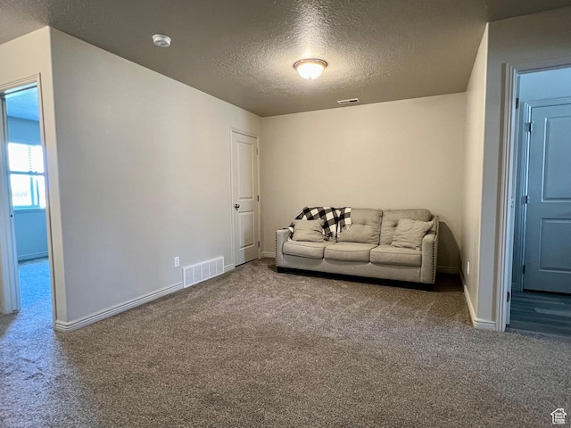 2594 E 600 N, Spanish Fork, UT 84660 - carpeted living area featuring a textured ceiling and baseboards