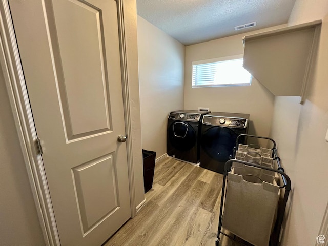 2594 E 600 N, Spanish Fork, UT 84660 - laundry room featuring independent washer and dryer, light wood finished floors, and a textured ceiling