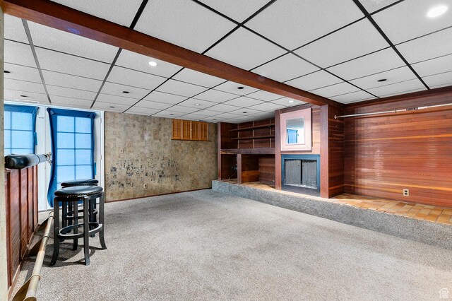 2011 W Todd Way S, Taylorsville, UT 84129 - unfurnished living room featuring carpet floors, a fireplace with raised hearth, a paneled ceiling, healthy amount of natural light, and recessed lighting