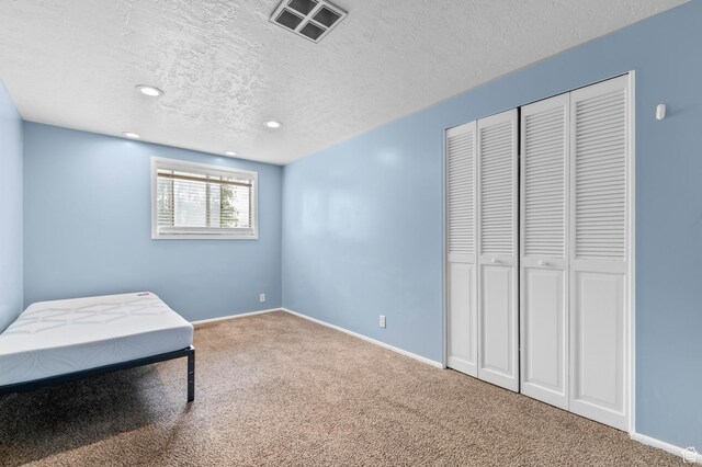 2011 W Todd Way S, Taylorsville, UT 84129 - unfurnished bedroom with carpet flooring, a textured ceiling, recessed lighting, a closet, and baseboards