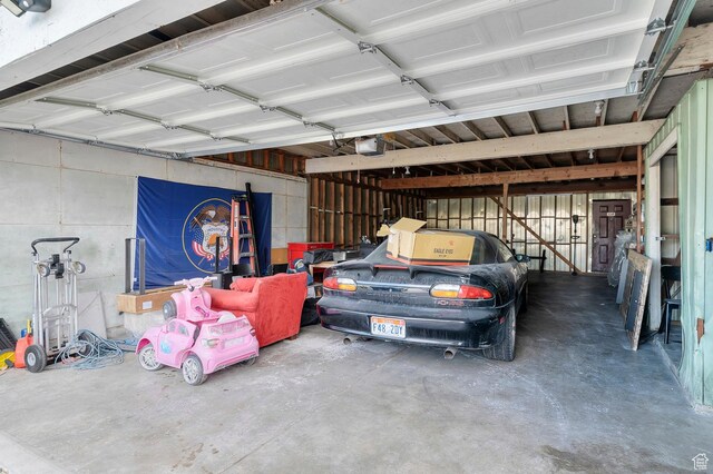 2011 W Todd Way S, Taylorsville, UT 84129 - garage featuring a garage door opener