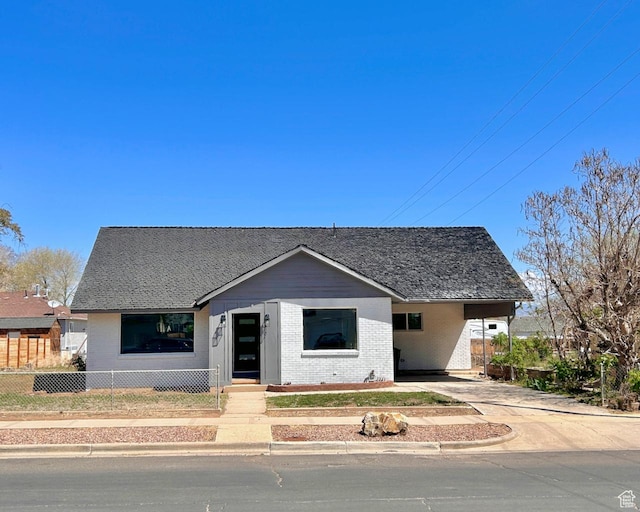 45 E 300 N, Roosevelt, UT 84066 - bungalow with brick siding, driveway, and an attached carport