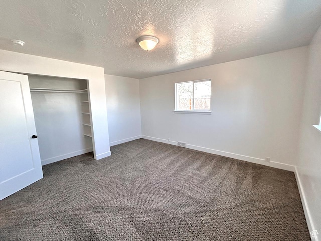 45 E 300 N, Roosevelt, UT 84066 - unfurnished bedroom featuring carpet, a textured ceiling, and a closet