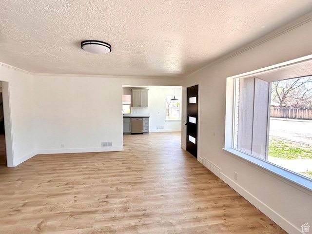 45 E 300 N, Roosevelt, UT 84066 - empty room with crown molding, a textured ceiling, light wood-style floors, and healthy amount of natural light