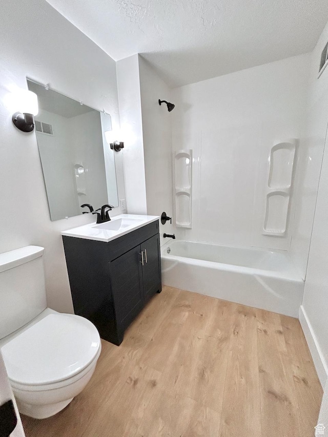 45 E 300 N, Roosevelt, UT 84066 - bathroom featuring wood finished floors, vanity, and tub / shower combination