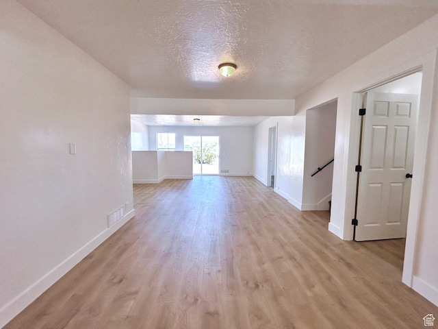 45 E 300 N, Roosevelt, UT 84066 - spare room with light wood-style floors and a textured ceiling
