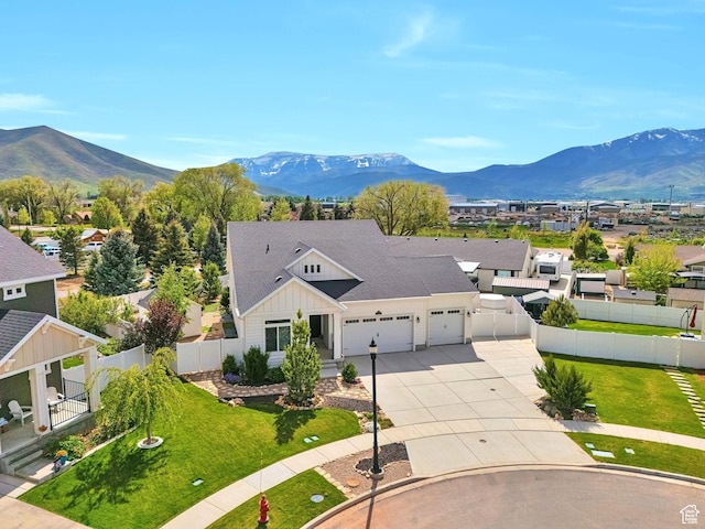2178 S 60 E Unit 37, Heber City, UT 84032 - view of front of house featuring an attached garage, board and batten siding, a mountain view, and driveway