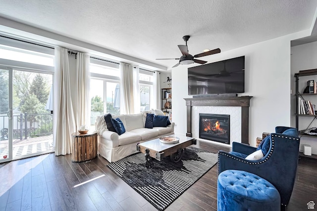 2178 S 60 E Unit 37, Heber City, UT 84032 - living room with a glass covered fireplace, a textured ceiling, hardwood / wood-style floors, and ceiling fan