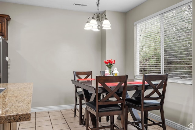 861 W 310 S, Pleasant Grove, UT 84062 - dining space with a chandelier, light tile patterned floors, and baseboards