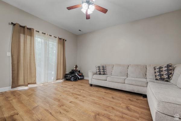 861 W 310 S, Pleasant Grove, UT 84062 - living room featuring wood finished floors, a ceiling fan, and baseboards
