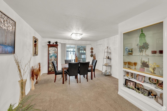 980 E 5475 S, South Ogden, UT 84405 - carpeted dining area featuring a chandelier and baseboards