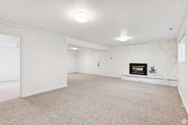573 S Cherry Ln, Fruit Heights, UT 84037 - unfurnished living room with carpet floors, a stone fireplace, and baseboards