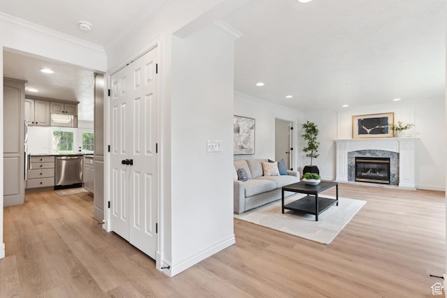 573 S Cherry Ln, Fruit Heights, UT 84037 - living area featuring light wood-style floors, ornamental molding, recessed lighting, a premium fireplace, and baseboards