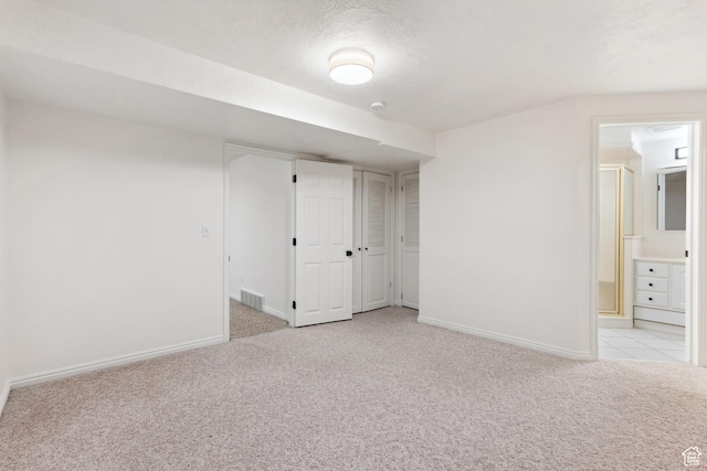 573 S Cherry Ln, Fruit Heights, UT 84037 - unfurnished bedroom with light colored carpet, baseboards, and ensuite bath