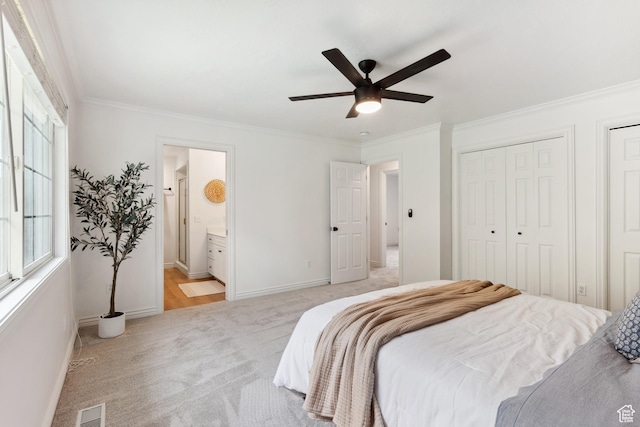 573 S Cherry Ln, Fruit Heights, UT 84037 - bedroom with light colored carpet, ornamental molding, baseboards, multiple closets, and ensuite bath