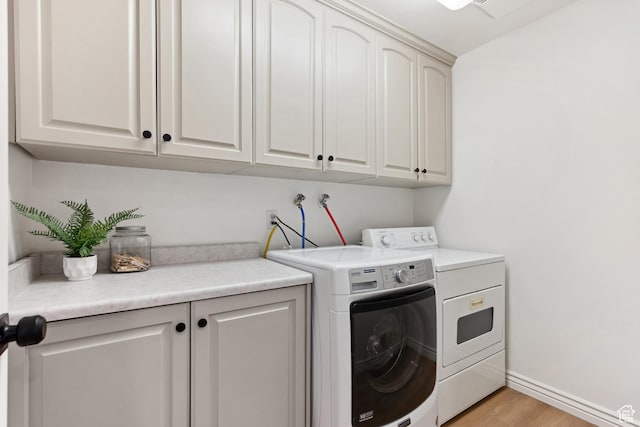 573 S Cherry Ln, Fruit Heights, UT 84037 - laundry room with cabinet space, separate washer and dryer, light wood-style floors, and baseboards