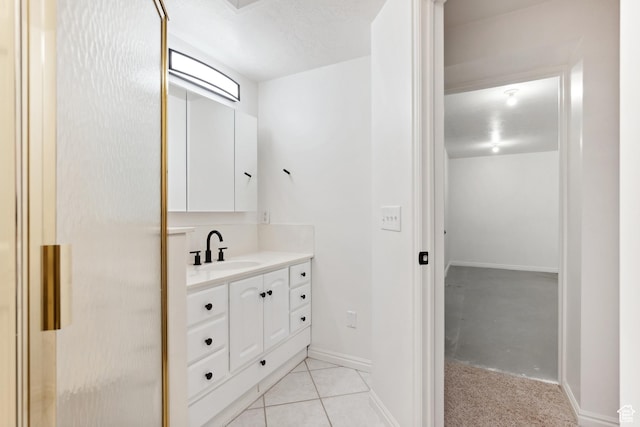 573 S Cherry Ln, Fruit Heights, UT 84037 - bathroom featuring vanity, baseboards, and tile patterned floors