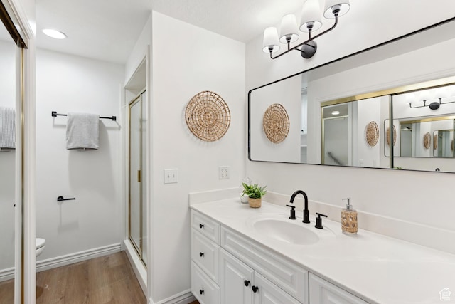 573 S Cherry Ln, Fruit Heights, UT 84037 - full bath with wood finished floors, vanity, a stall shower, toilet, and baseboards
