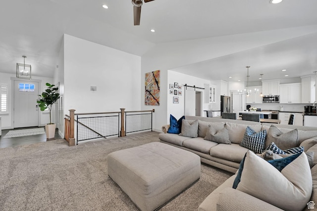3507 S 4875 W, West Haven, UT 84401 - living room with a chandelier, lofted ceiling, recessed lighting, a barn door, and ceiling fan