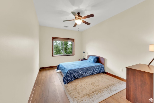 2011 S 2100 E Unit 308, Salt Lake City, UT 84108 - bedroom featuring baseboards, wood finished floors, and a ceiling fan