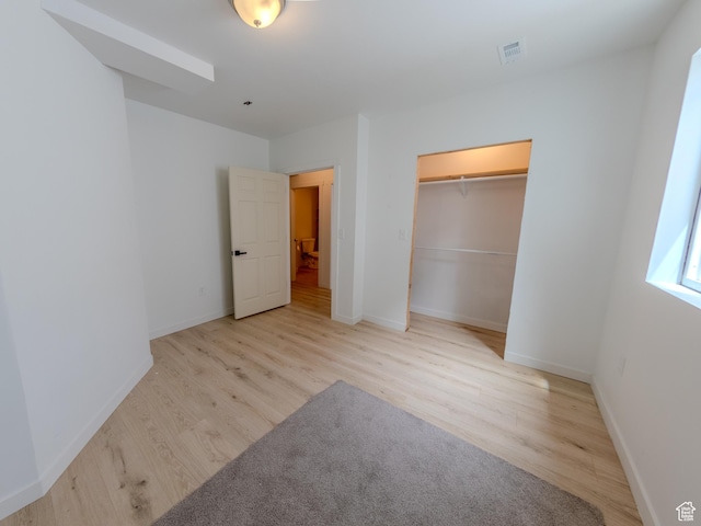 1622 N Baen Way E, Tooele, UT 84074 - unfurnished bedroom featuring wood finished floors, baseboards, and a closet