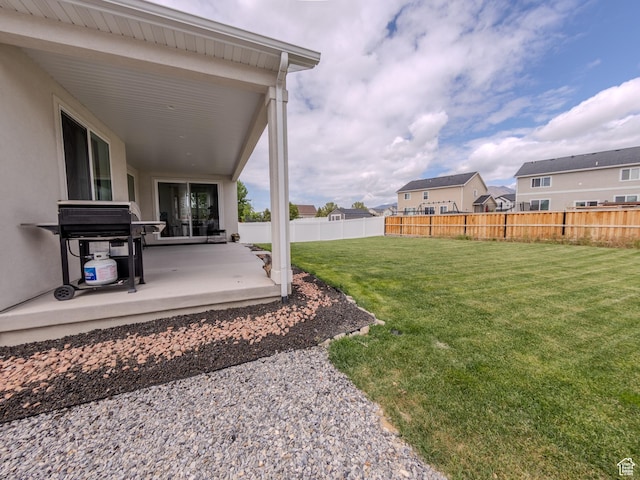 1622 N Baen Way E, Tooele, UT 84074 - view of yard with a patio