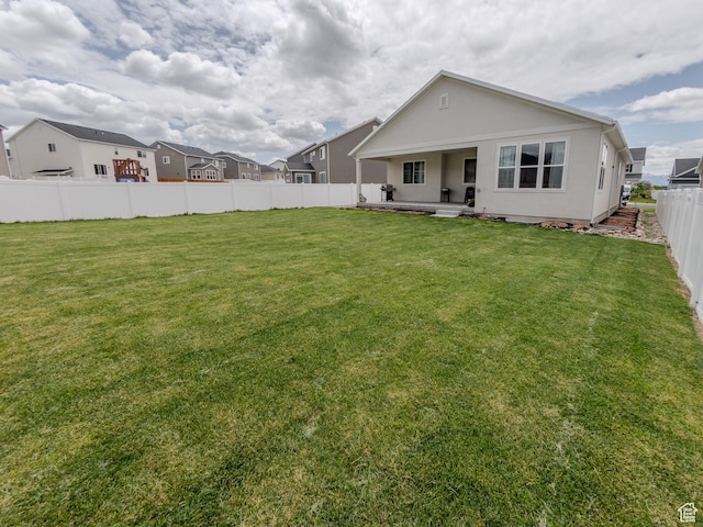 1622 N Baen Way E, Tooele, UT 84074 - back of property with stucco siding and a patio