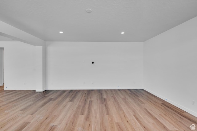 139 E Heron Ave S Unit 809, Saratoga Springs, UT 84045 - spare room with baseboards, light wood finished floors, and recessed lighting