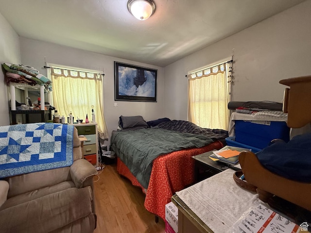 bedroom featuring wood finished floors