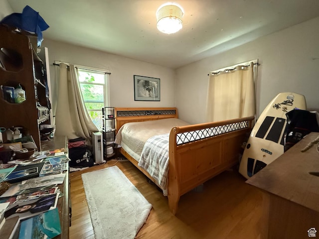 bedroom with wood finished floors
