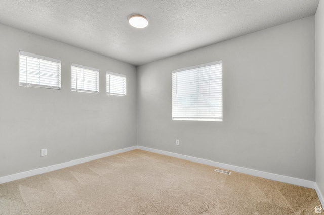 2293 W Prevedel Dr, West Haven, UT 84401 - empty room with light colored carpet, baseboards, and a textured ceiling