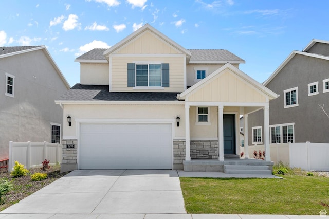 2293 W Prevedel Dr, West Haven, UT 84401 - view of front of home featuring stone siding, driveway, roof with shingles, and board and batten siding