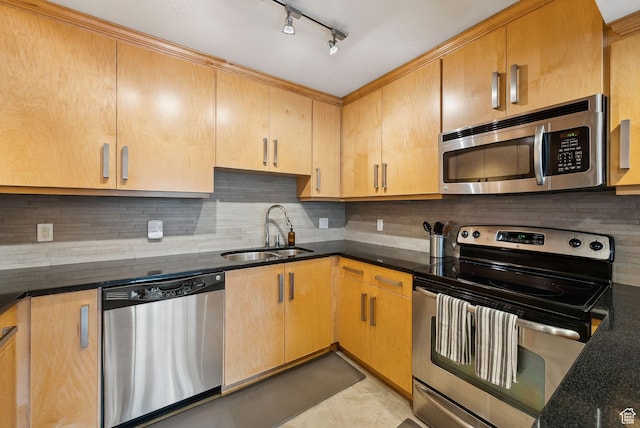 230 E Broadway E Unit 403, Salt Lake City, UT 84111 - kitchen featuring appliances with stainless steel finishes, a sink, backsplash, and dark stone countertops