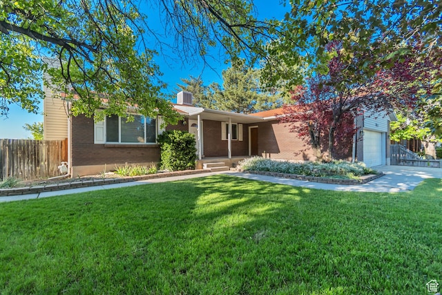 3236 W New World Dr S, West Jordan, UT 84084 - view of front of property with brick siding, a garage, a chimney, and central AC