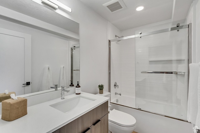 4186 S Main St Unit N220, Millcreek, UT 84107 - bathroom featuring toilet, bath / shower combo with glass door, vanity, and recessed lighting